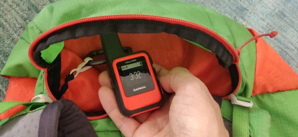 My inReach Mini where it mostly sits: stowed away in the top lid of my backpack.